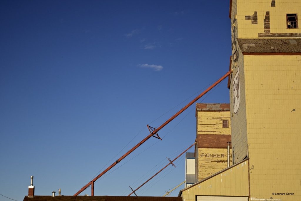 series of grain elevators against blue sky