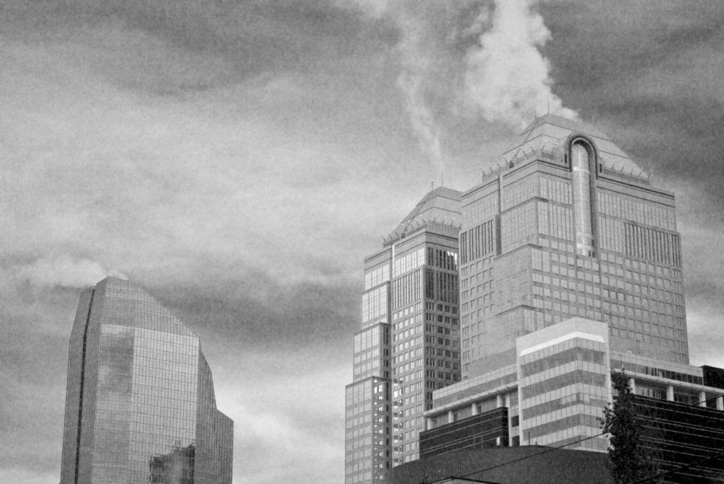 grainy office towers in winter steam