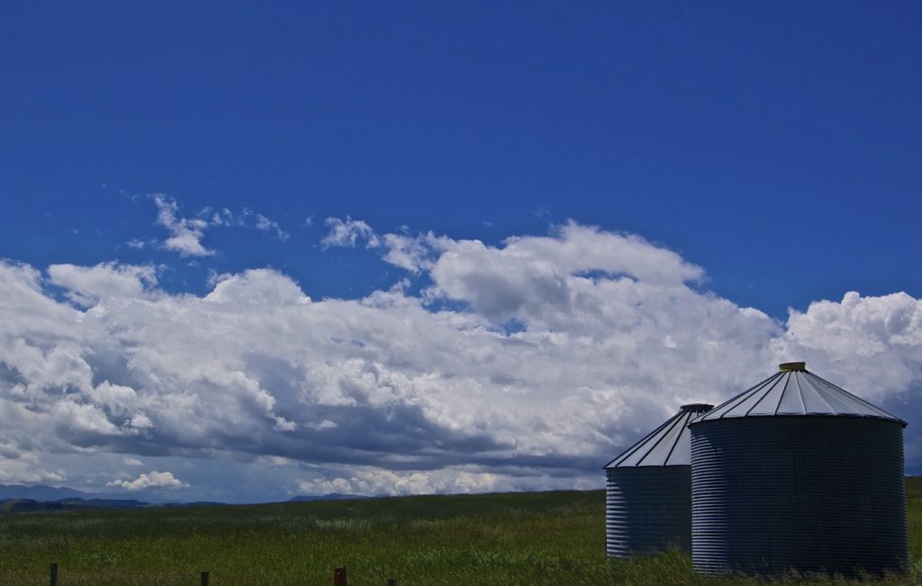 grain silos and clouds summer